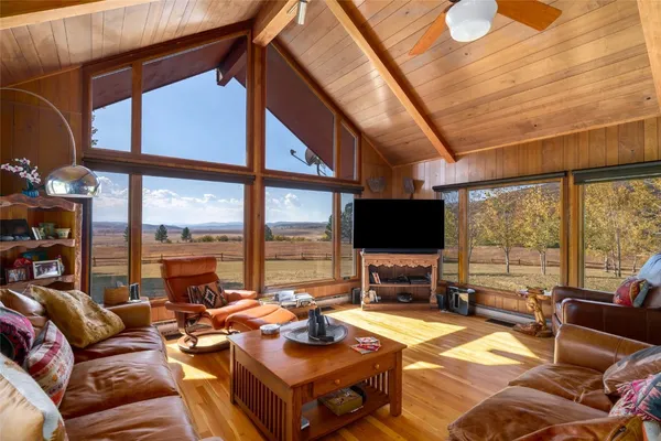 a view of a dining room with furniture window and outside view