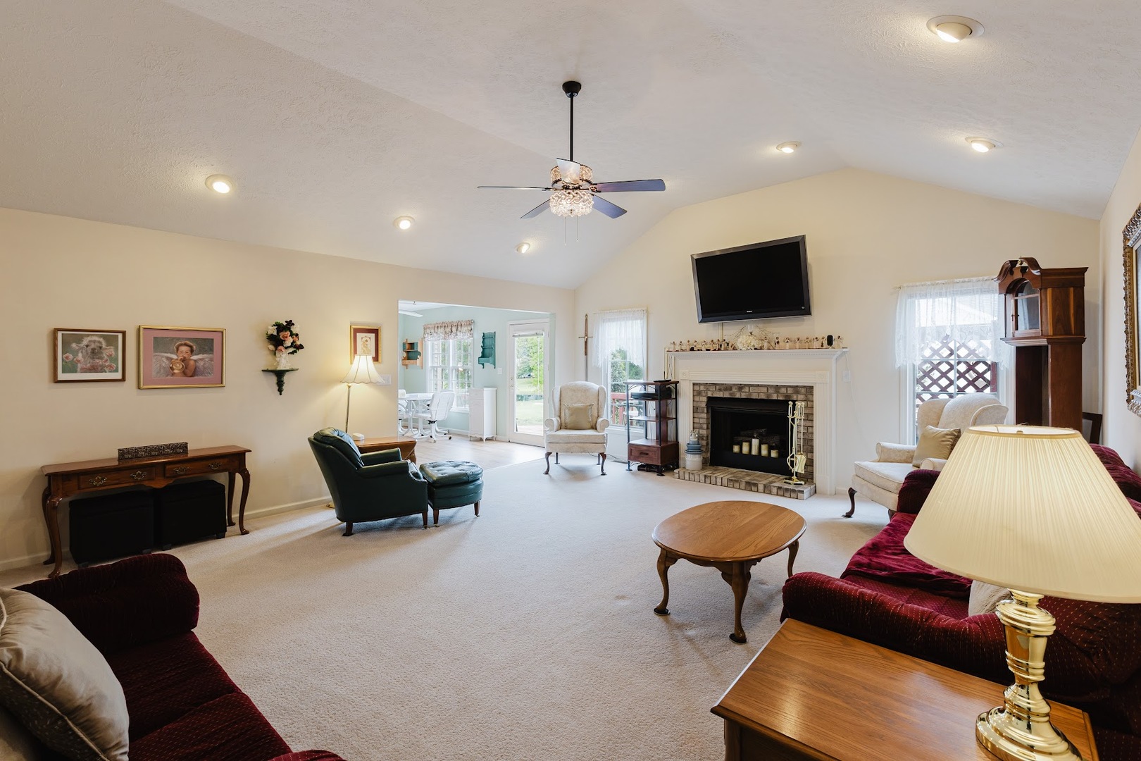 15136 Eastland Road Marion, IL 62959 - Photo 18 of 49 a living room with furniture a fireplace and a flat screen tv