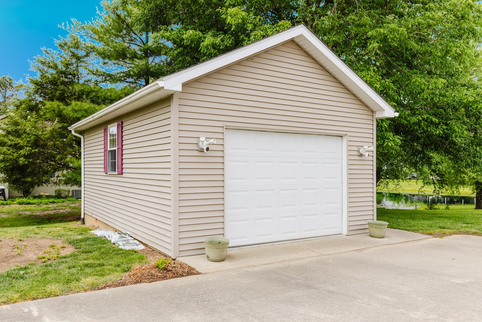 15136 Eastland Road Marion, IL 62959 - Photo 6 of 49 a view of a white house with a yard and garage