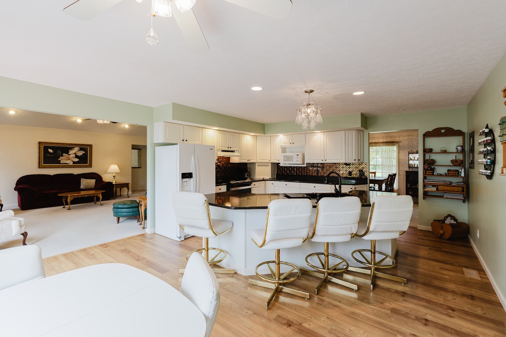15136 Eastland Road Marion, IL 62959 - Photo 10 of 49 a living room with furniture a wooden floor and kitchen view