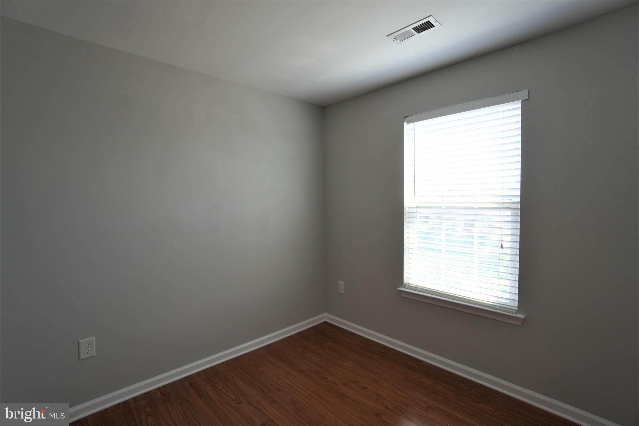 900 Susan Circle North Wales, PA 19454 - Photo 20 of 30 a view of an empty room with wooden floor and a window