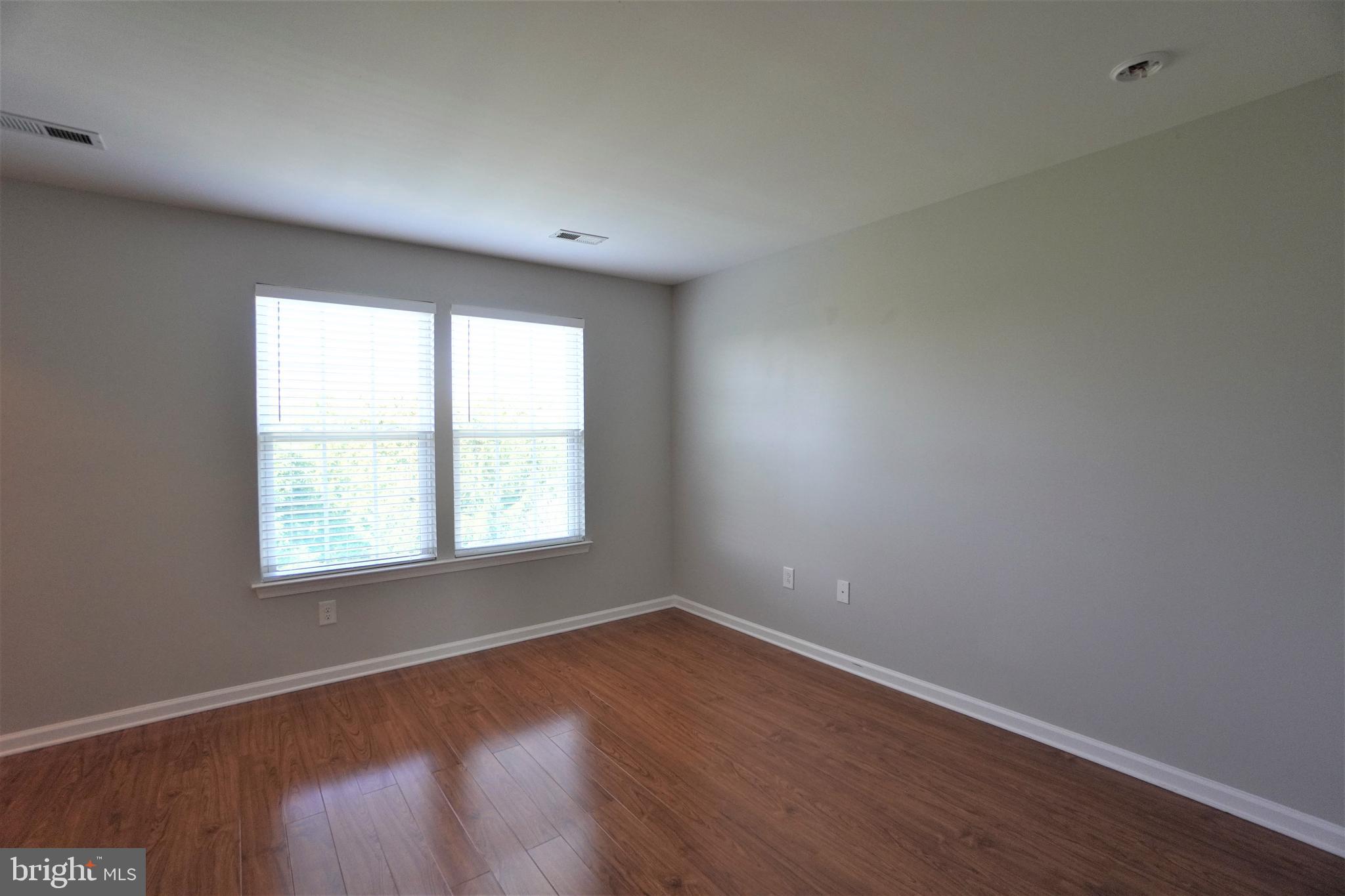 900 Susan Circle North Wales, PA 19454 - Photo 23 of 30 an empty room with wooden floor and windows