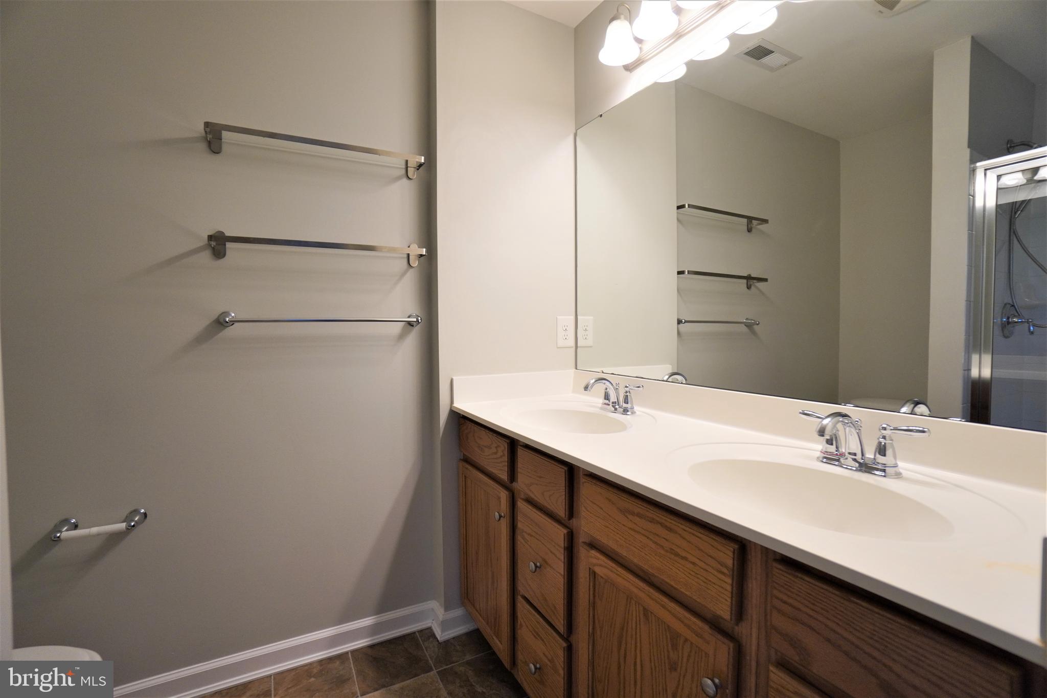 900 Susan Circle North Wales, PA 19454 - Photo 27 of 30 a bathroom with a sink double vanity and a mirror