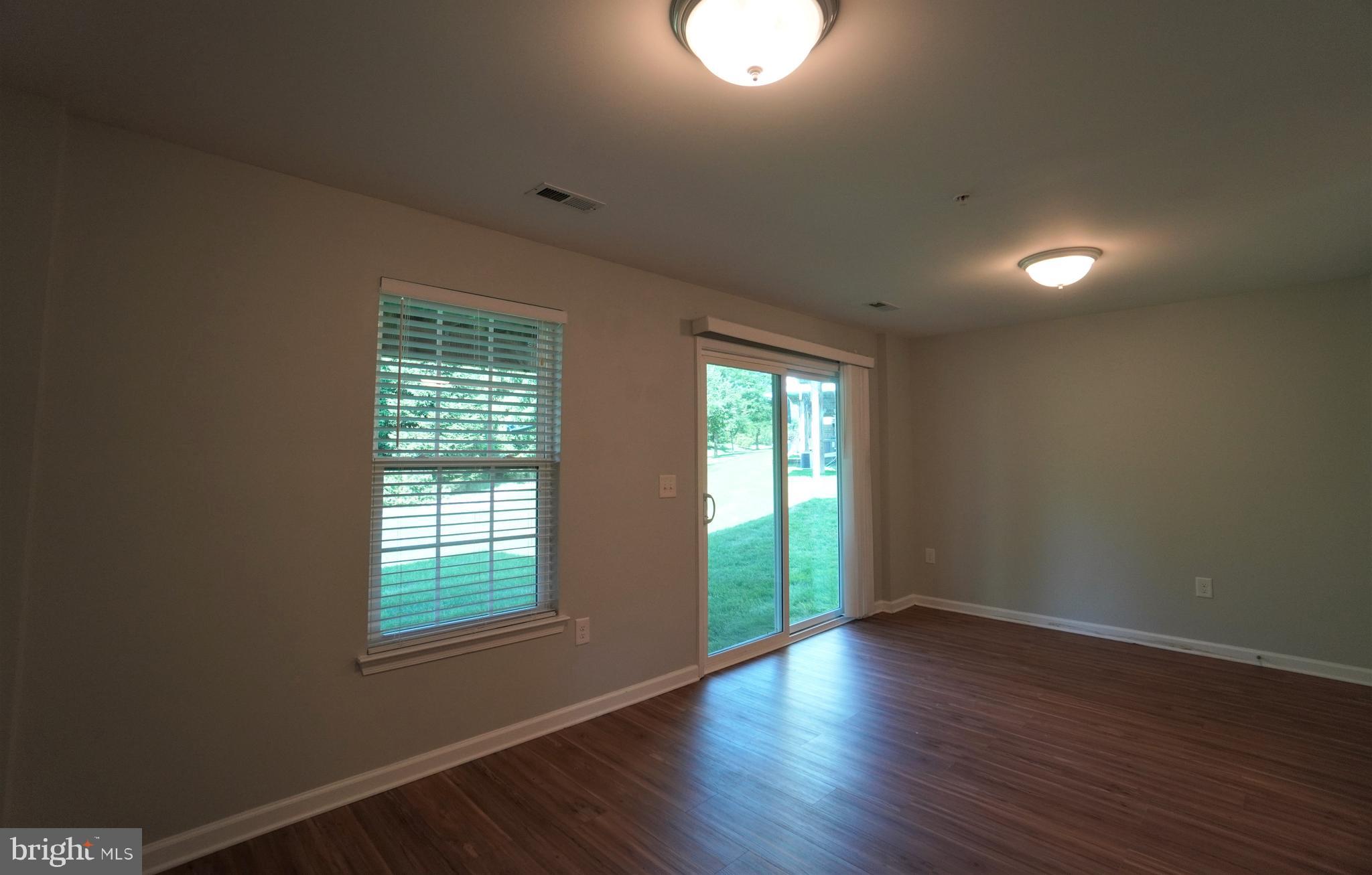 900 Susan Circle North Wales, PA 19454 - Photo 7 of 30 an empty room with wooden floor and windows