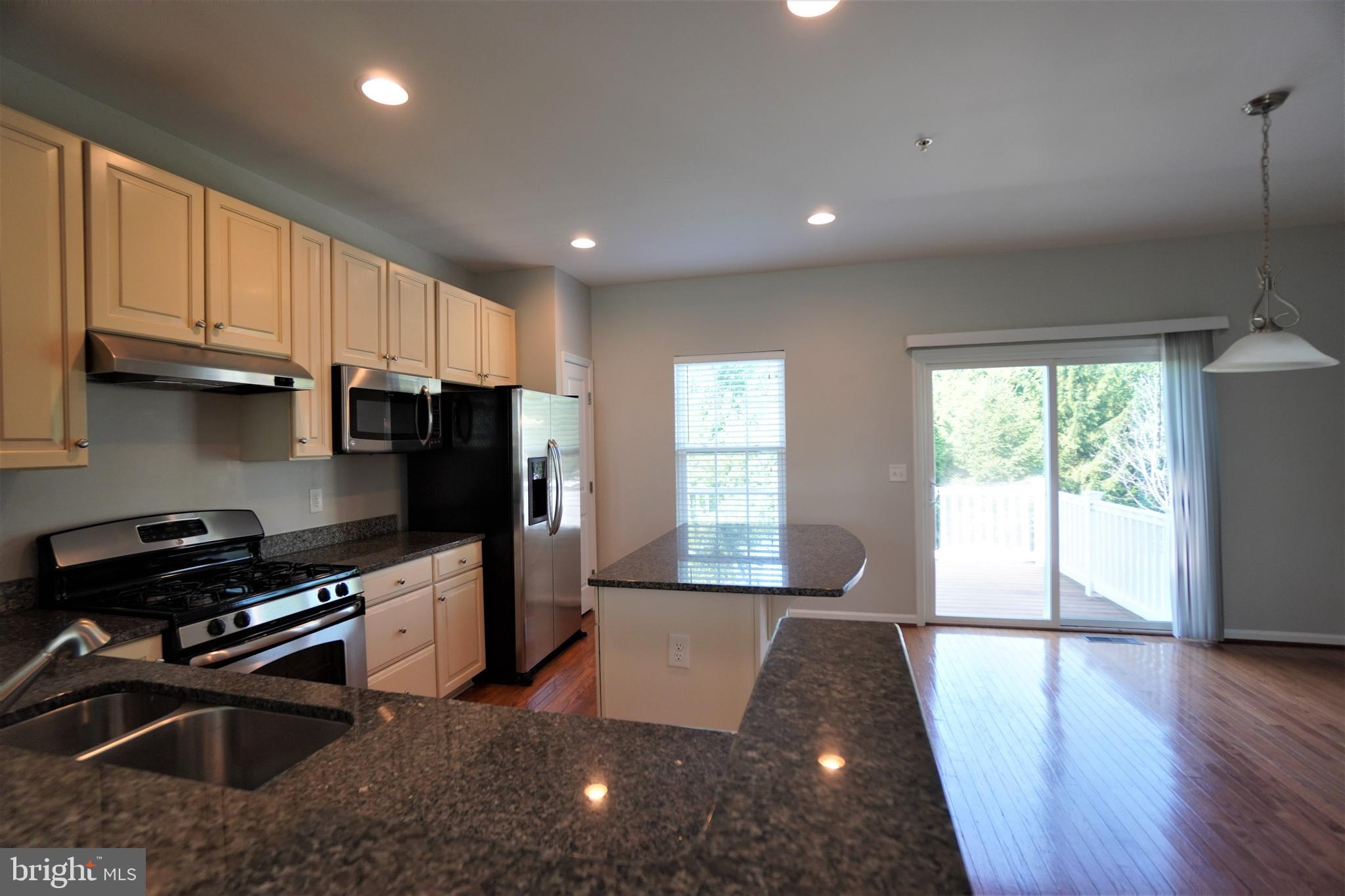 900 Susan Circle North Wales, PA 19454 - Photo 9 of 30 a kitchen with stainless steel appliances a refrigerator a stove a sink a washer dryer and a cabinets