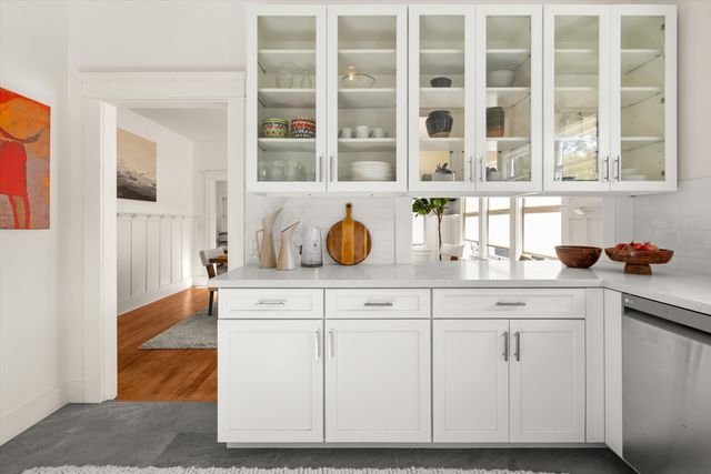 a kitchen with cabinets and window