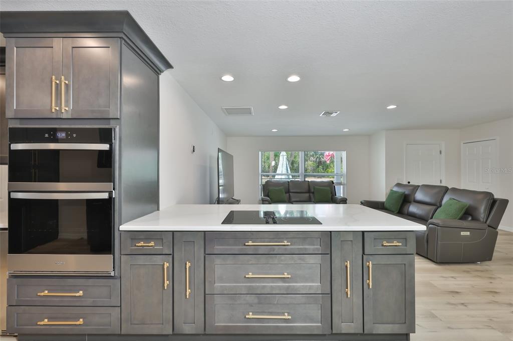 1578 Indian Bay Road Spring Hill, FL 34607 - Photo 13 of 51 a kitchen with a sink and cabinets