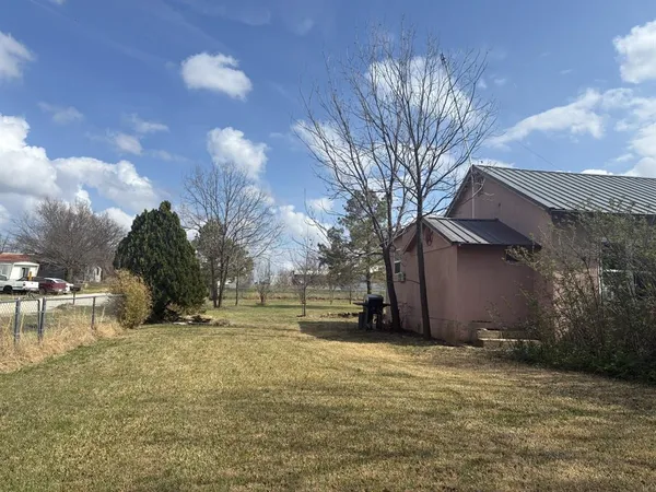a view of a park with large trees