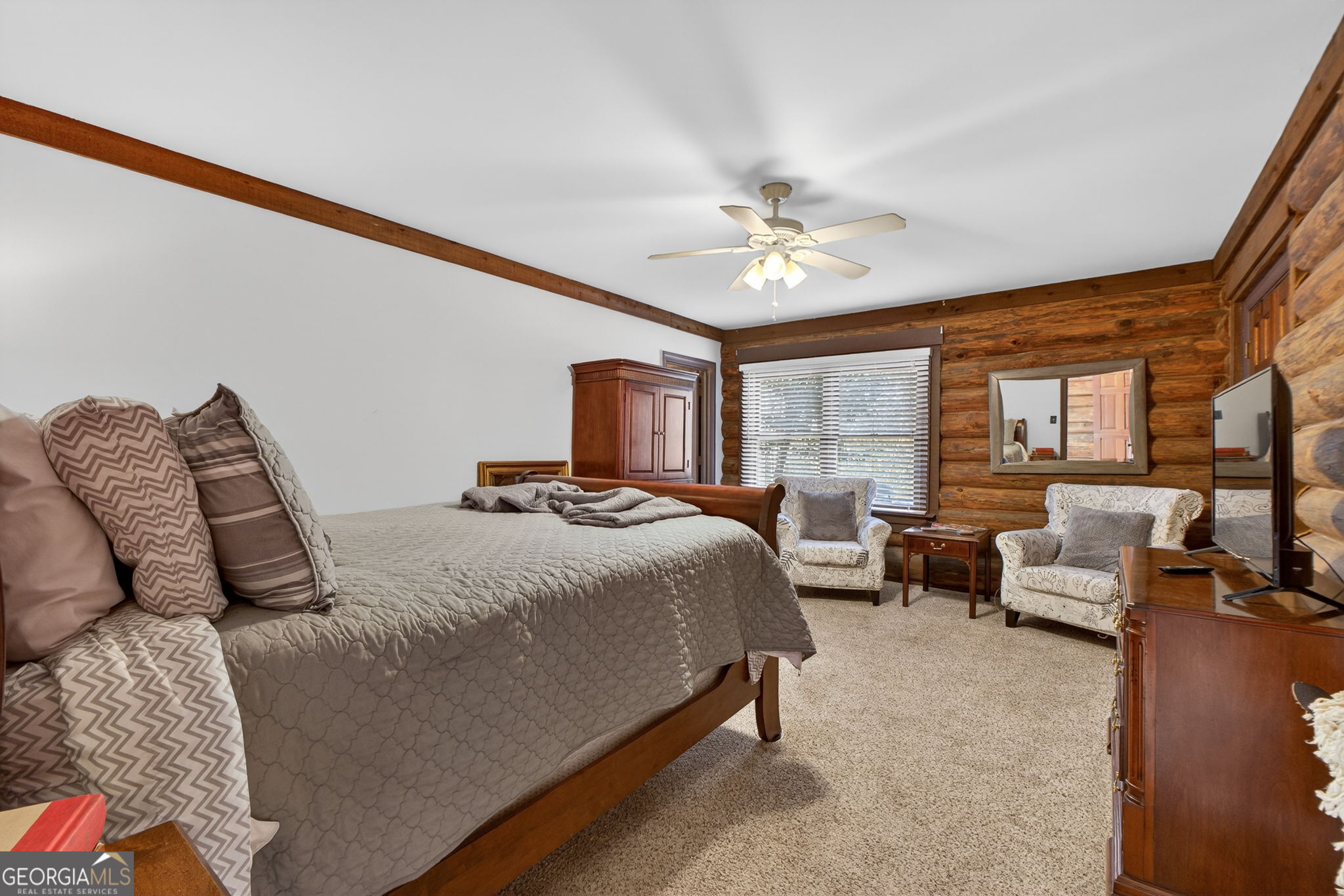 261 McIntosh Circle Jackson, GA 30233 - Photo 37 of 77 a bedroom with furniture and a large window