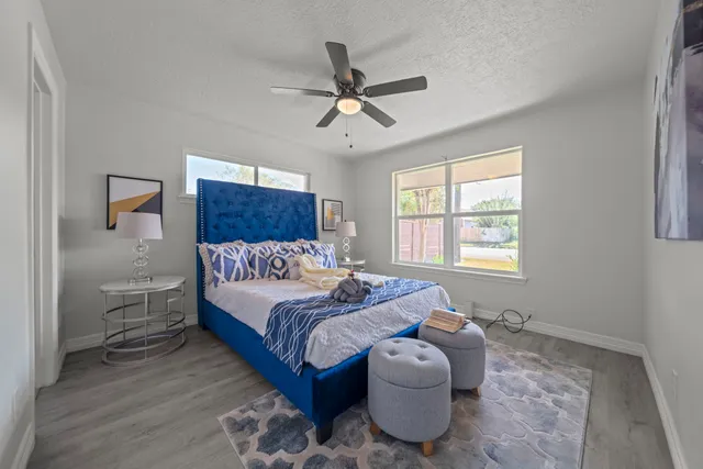 a bedroom with a bed and window