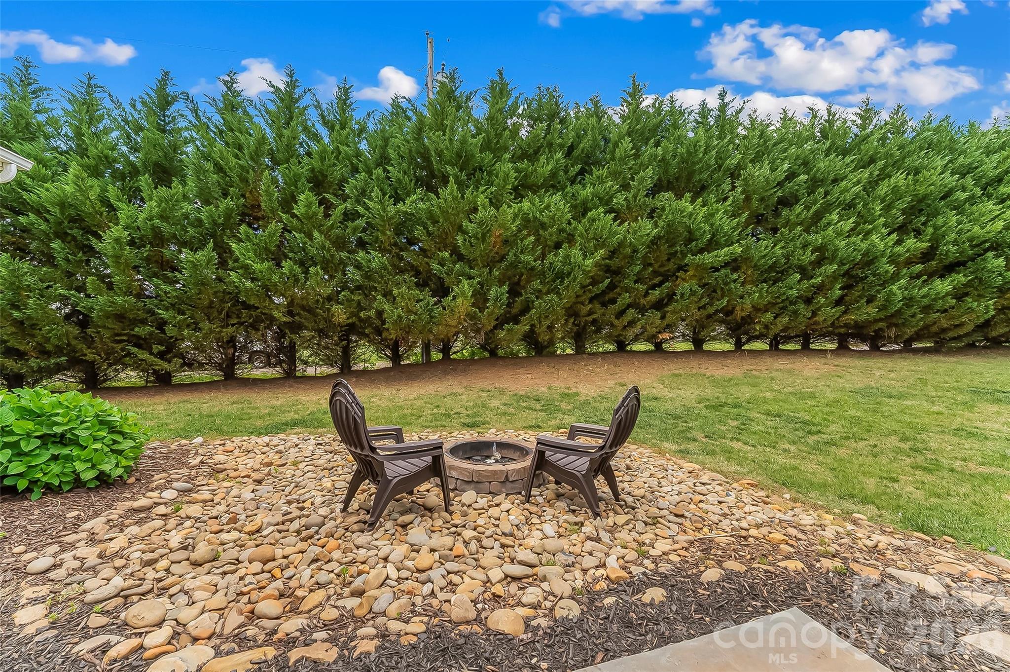 1498 Salem Road Morganton, NC 28655 - Photo 27 of 32 a view of a chairs and table on the garden
