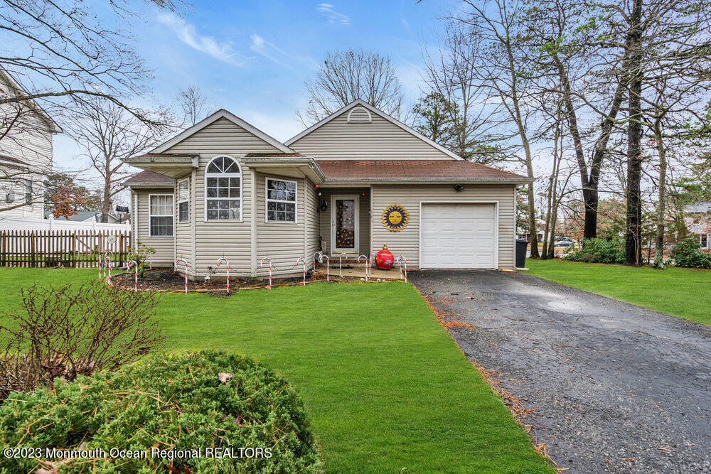 149 Marlin Road Manahawkin, NJ 08050 - Photo 1 of 36 a front view of a house with a garden