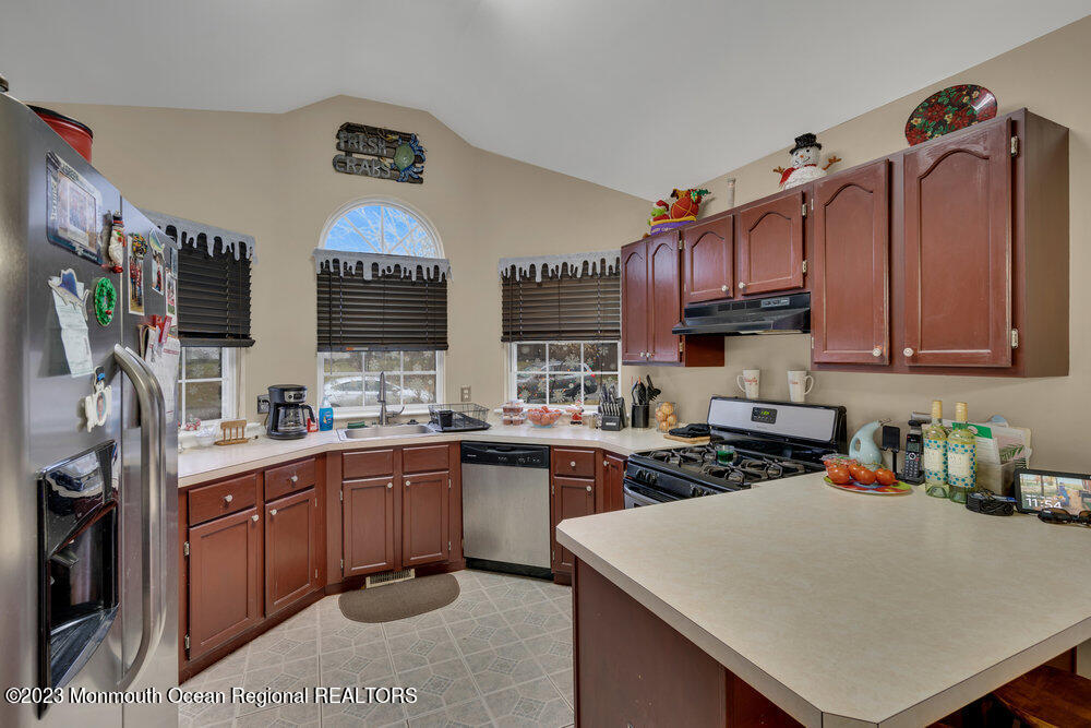149 Marlin Road Manahawkin, NJ 08050 - Photo 11 of 36 a kitchen with lots of counter top space appliances and cabinets