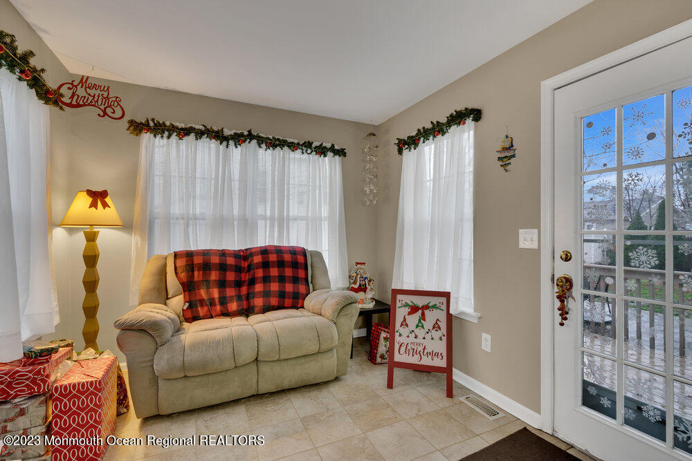 149 Marlin Road Manahawkin, NJ 08050 - Photo 14 of 36 a living room with furniture and a window