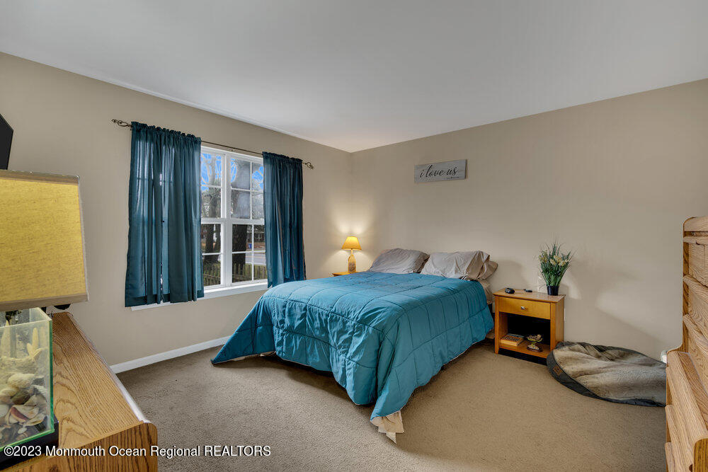 149 Marlin Road Manahawkin, NJ 08050 - Photo 15 of 36 a bedroom with a bed and a window