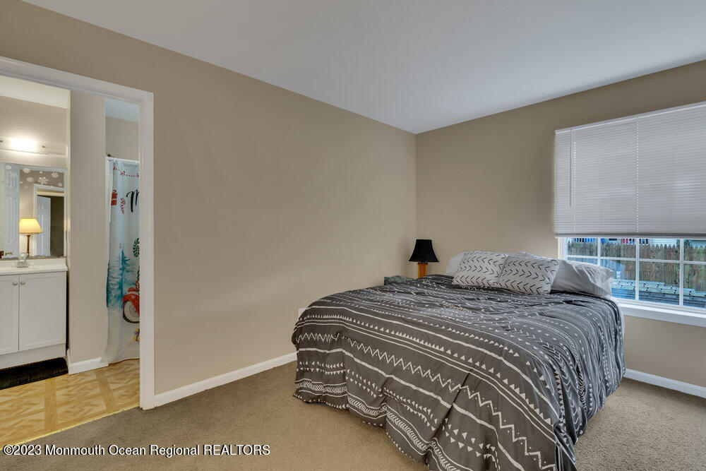 149 Marlin Road Manahawkin, NJ 08050 - Photo 20 of 36 a bedroom with a bed and a window
