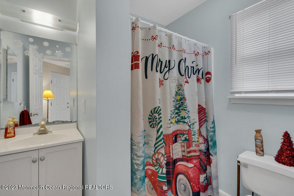 149 Marlin Road Manahawkin, NJ 08050 - Photo 22 of 36 a bathroom with a sink and a mirror