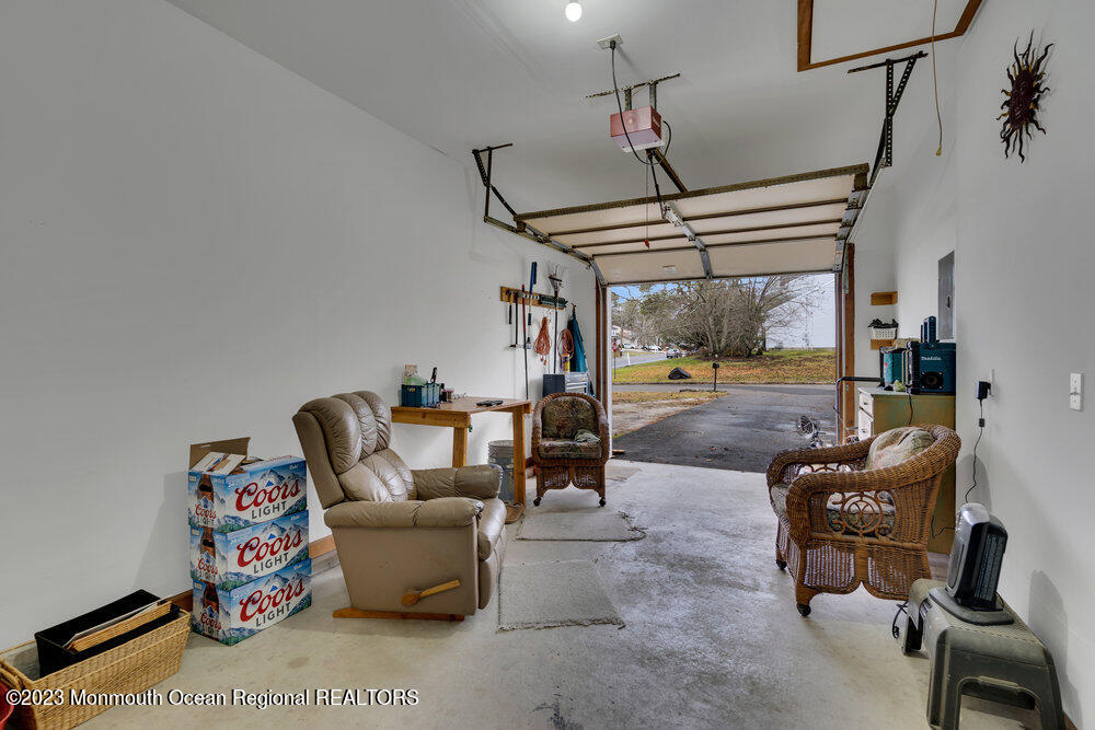 149 Marlin Road Manahawkin, NJ 08050 - Photo 25 of 36 a living room with furniture and a chandelier