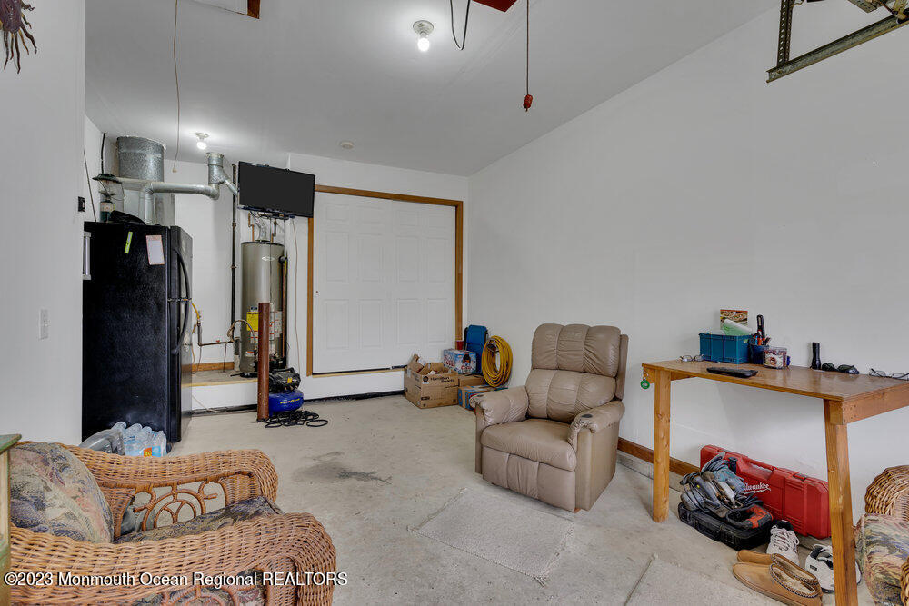 149 Marlin Road Manahawkin, NJ 08050 - Photo 26 of 36 a bedroom with furniture and a gym equipment