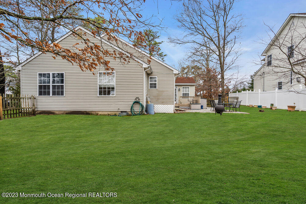 149 Marlin Road Manahawkin, NJ 08050 - Photo 28 of 36 a front view of house with yard and green space