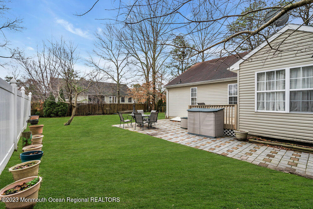149 Marlin Road Manahawkin, NJ 08050 - Photo 34 of 36 a view of a house with backyard porch and sitting area