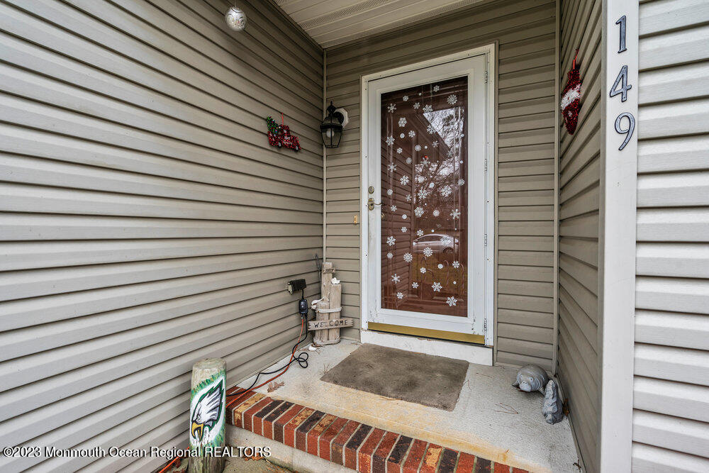 149 Marlin Road Manahawkin, NJ 08050 - Photo 4 of 36 a view of front door and porch