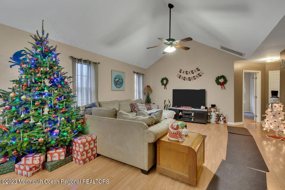 149 Marlin Road Manahawkin, NJ 08050 - Photo 6 of 36 a living room with furniture and a flat screen tv