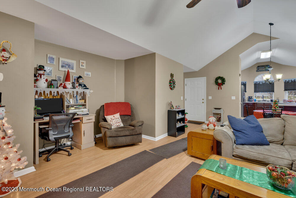 149 Marlin Road Manahawkin, NJ 08050 - Photo 8 of 36 a living room with furniture and a dining area
