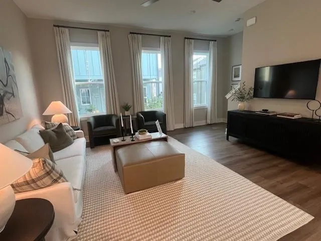 a living room with furniture and a flat screen tv