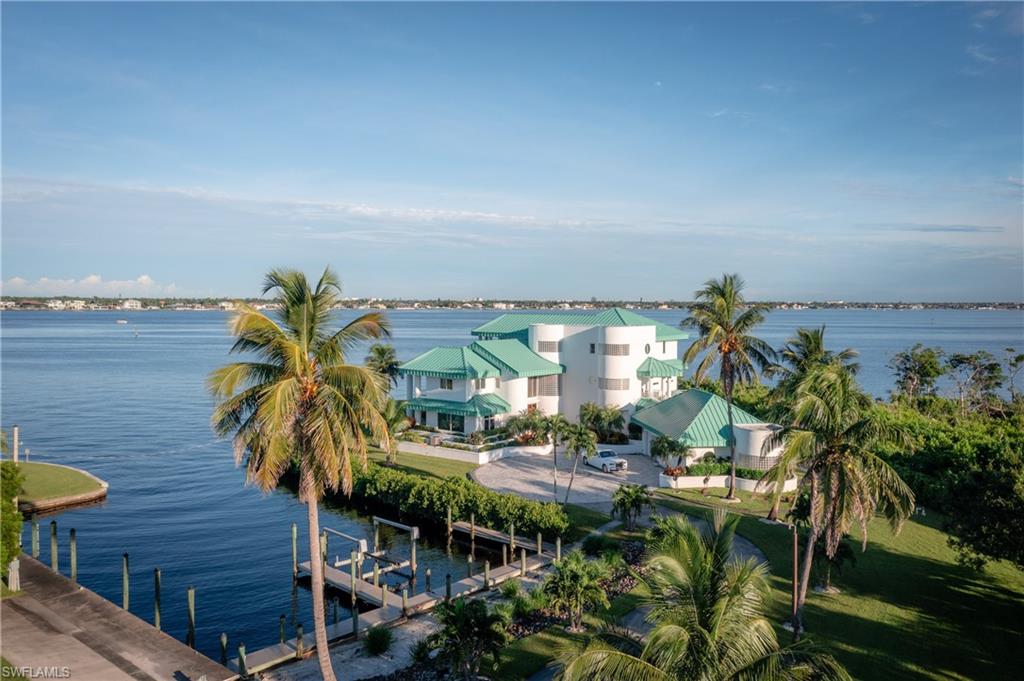 14040 Schultz Road Fort Myers, FL 33908 - Photo 2 of 48 Water view featuring a boat dock and boat lift