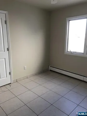 a view of a room that has a window in it