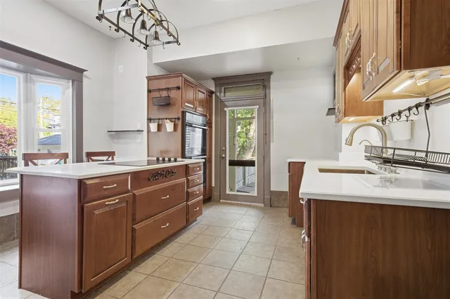 a spacious bathroom with a sink a mirror and a bathtub