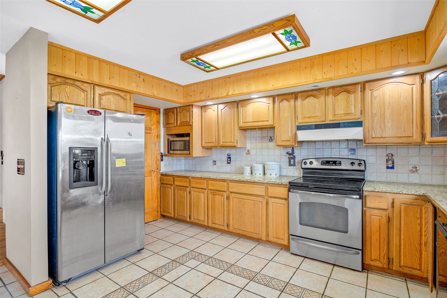 597 Sheep Ridge Road Fairplay, CO 80440 - Photo 9 of 50 a kitchen with stainless steel appliances granite countertop a refrigerator and a stove top oven