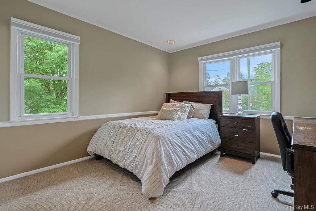 305 Stratton Road New Rochelle, NY 10804 - Photo 23 of 32 a bedroom with a bed and a window