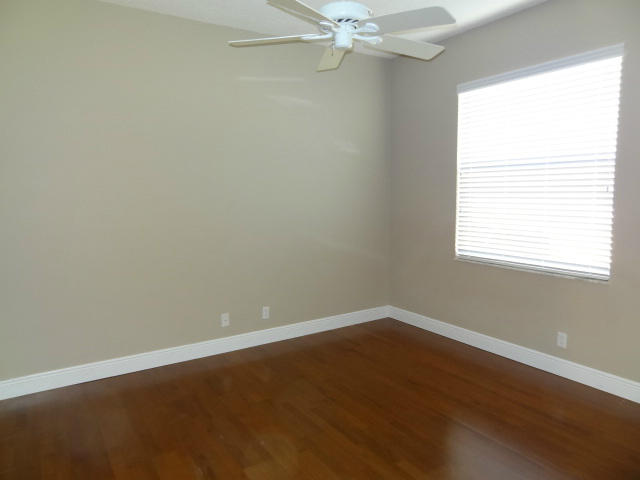 12226 Rockledge Circle Boca Raton, FL 33428 - Photo 17 of 28 SECOND BEDROOM W/LAMINATE FLOORS
