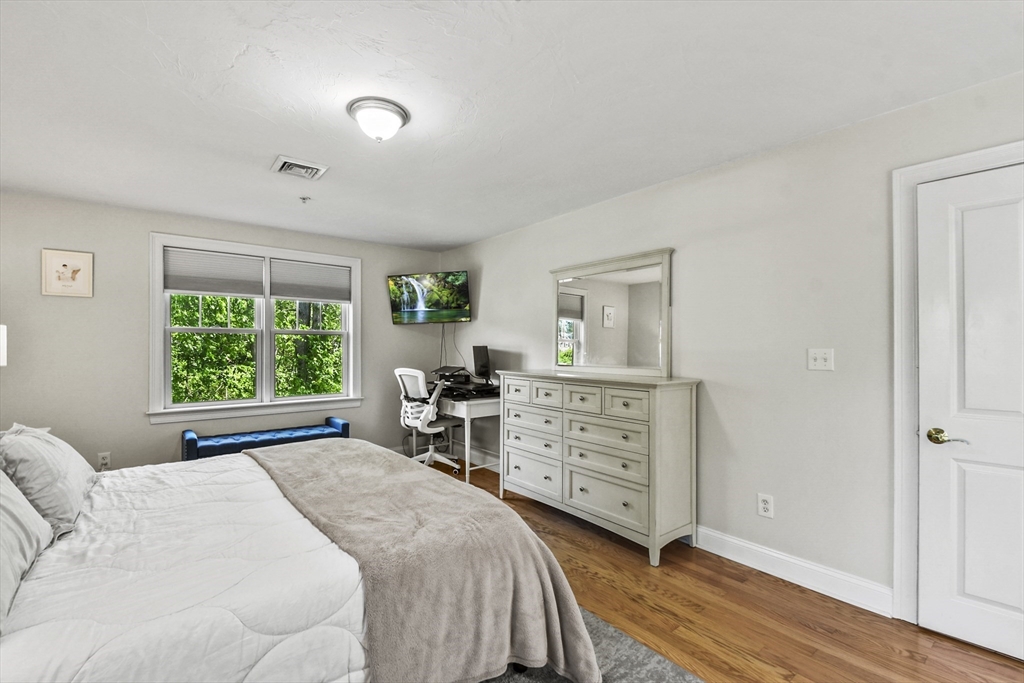 29 Maple Street, Unit C Canton, MA 02021 - Photo 11 of 27 a bedroom with a bed and a dresser