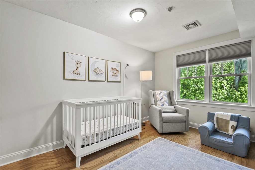 29 Maple Street, Unit C Canton, MA 02021 - Photo 18 of 27 a bed room with furniture and a window