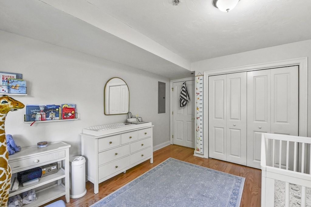29 Maple Street, Unit C Canton, MA 02021 - Photo 19 of 27 a view of a bedroom with baby bed closet and bedroom