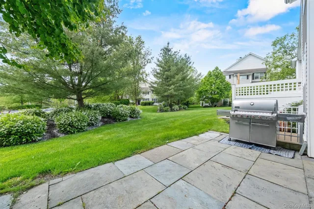 a view of a patio with a yard