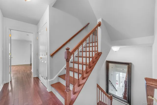a view of an entryway with wooden floor