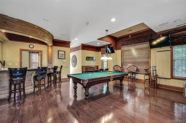 a room with lots of furniture and wooden floor