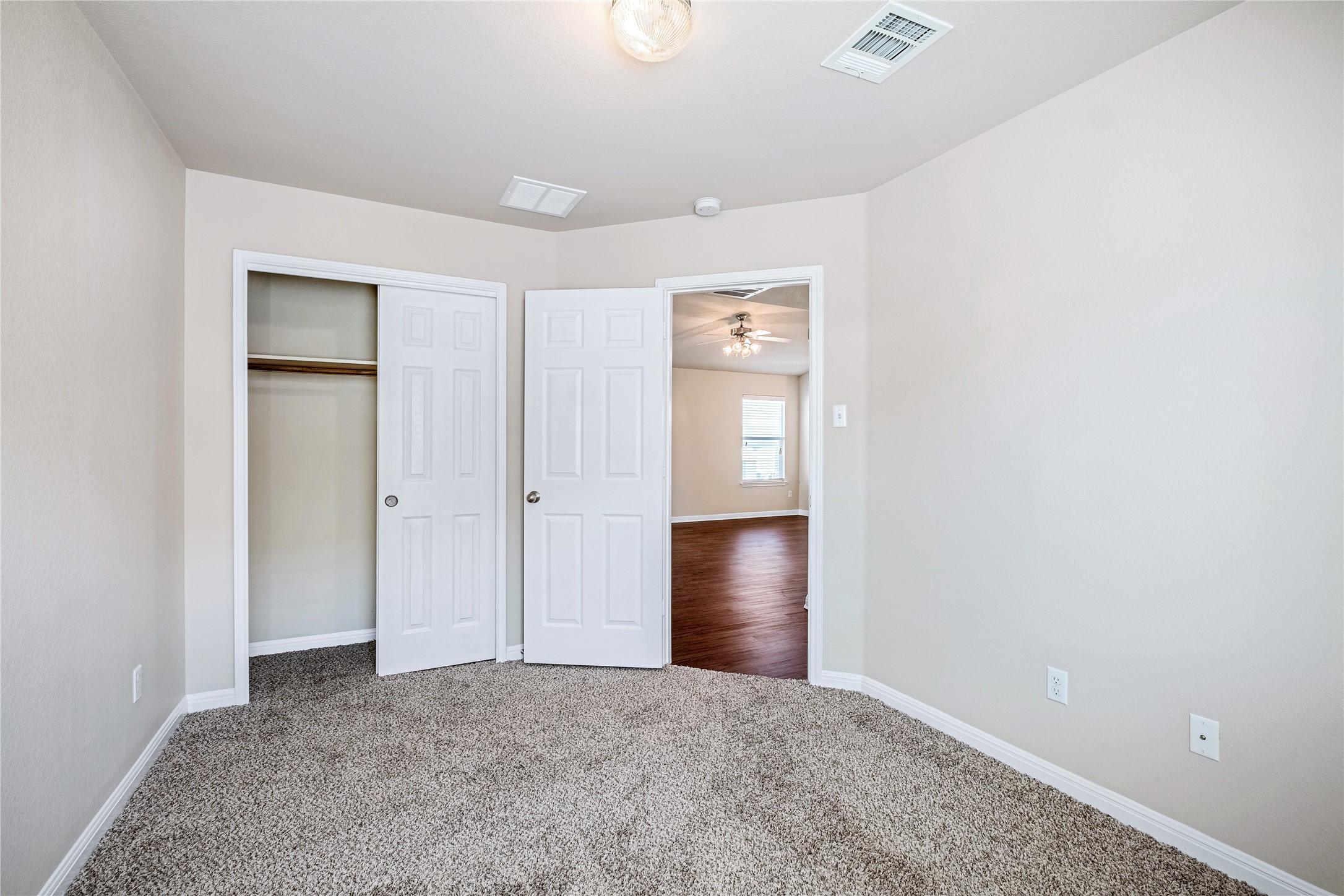 320 Comal Run Hutto, TX 78634 - Photo 17 of 21 an empty room with closet and windows