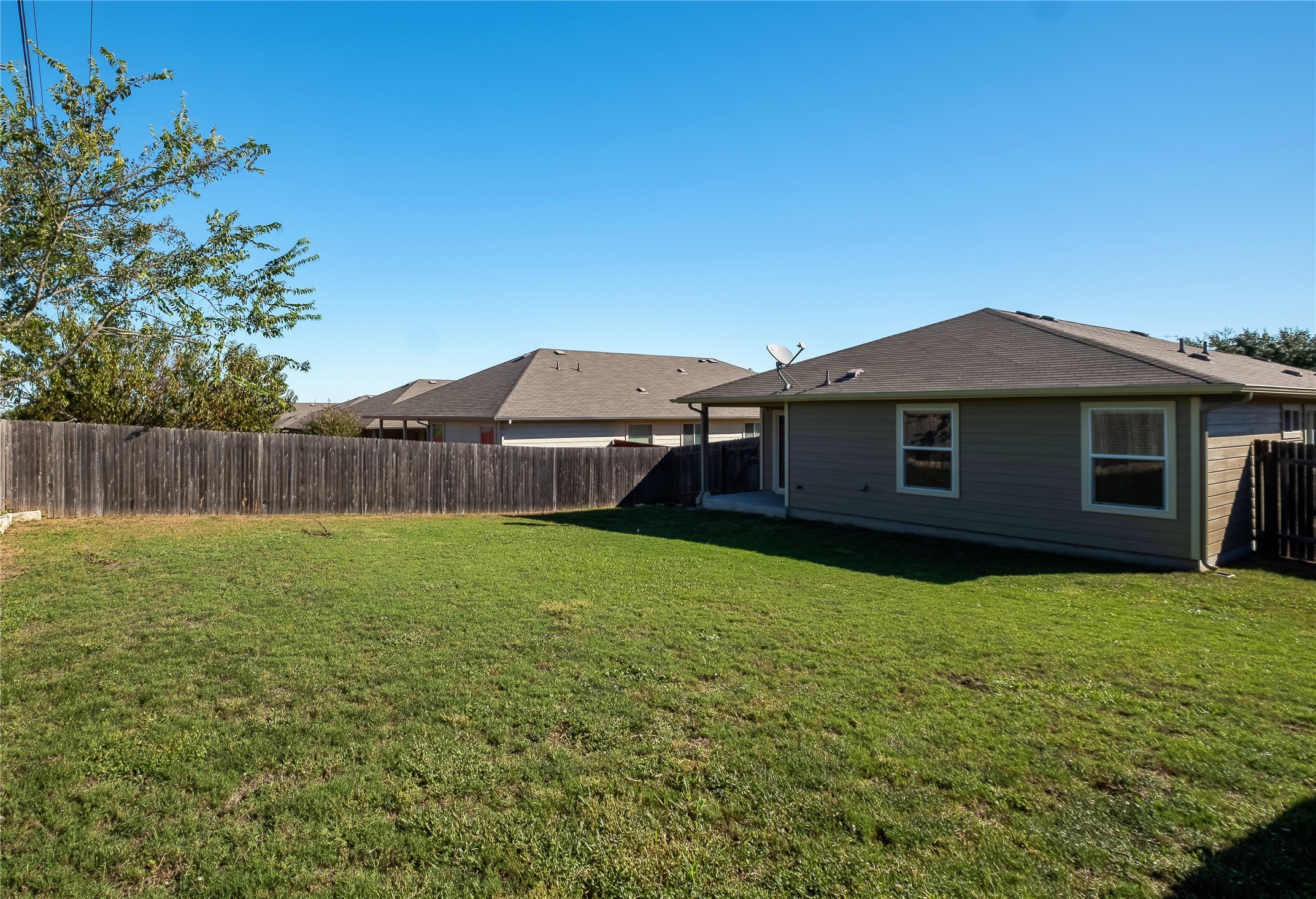 320 Comal Run Hutto, TX 78634 - Photo 20 of 21 a view of a house with a yard
