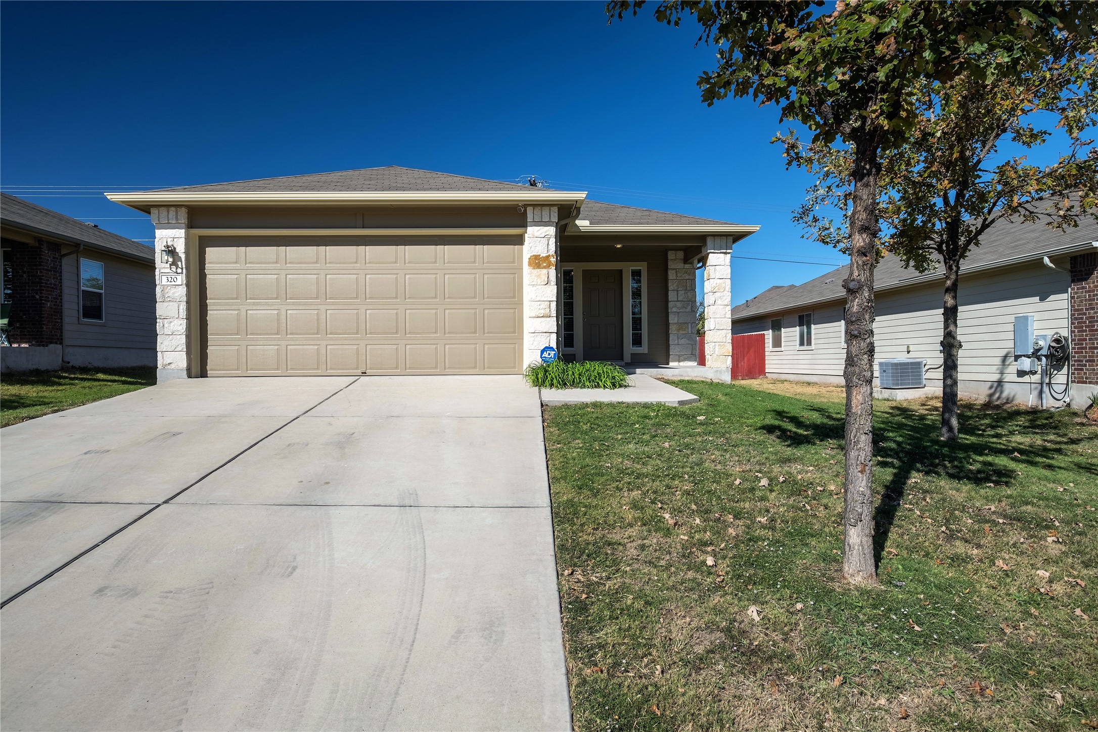 320 Comal Run Hutto, TX 78634 - Photo 2 of 21 a front view of a house with garden