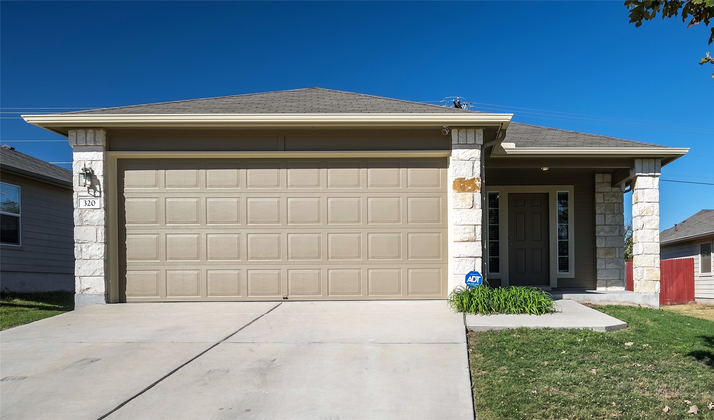 320 Comal Run Hutto, TX 78634 - Photo 3 of 21 a front view of a house with a yard