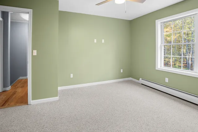 an empty room with a empty space and a window