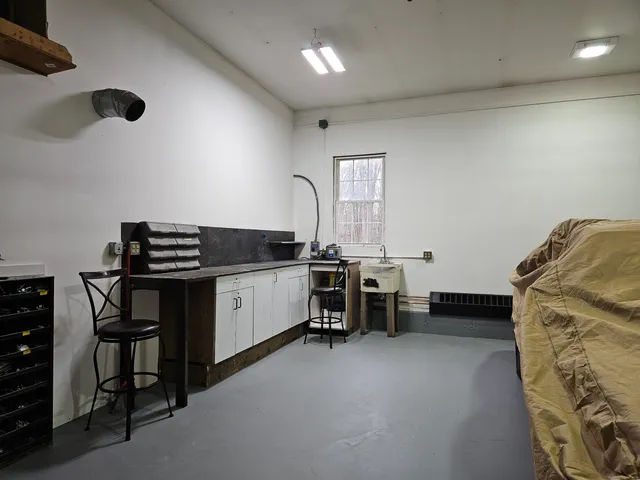 a kitchen with a cabinets and chairs