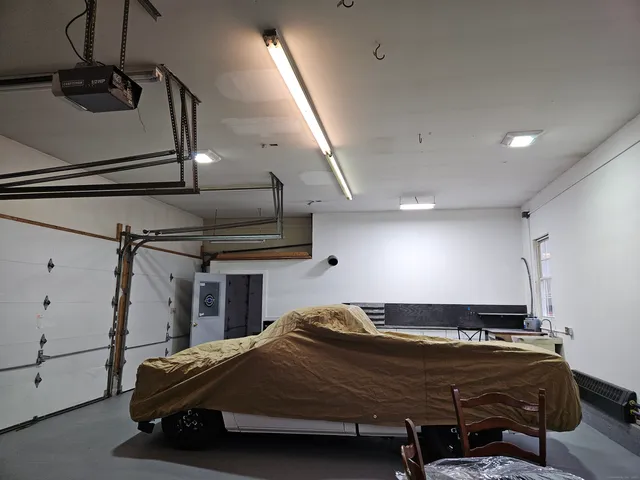 a bedroom with a bed and a ceiling fan