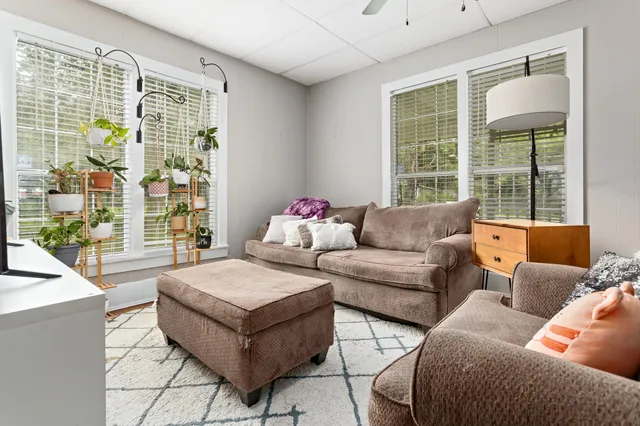 a living room with furniture and a large window