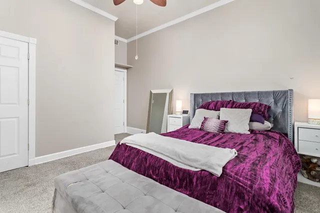 a bedroom with a large bed and a closet